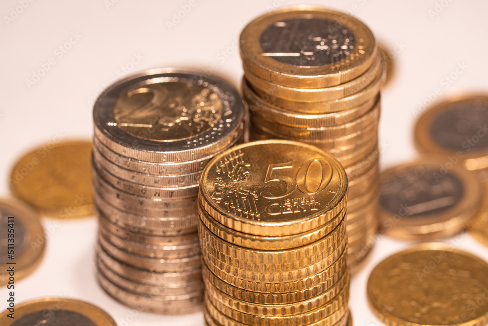 Stacked one euro, two euro and fifty cent coins. European currency. Stacked one euro, two euro and fifty cent coins. European currency.