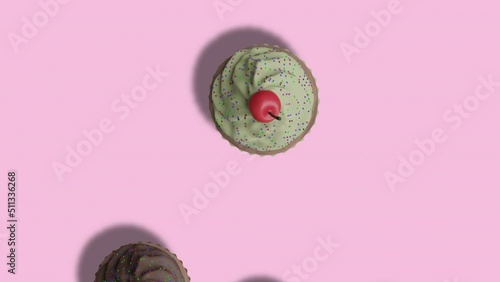 Animation Lots of Colorful Cupcakes with Cherryes Moving down on Pink Abstract Background. Birthday cakes photo