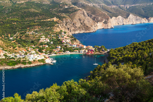 Fantastic top view at Asos village, Assos peninsula and blue Ionian Sea water. Aerial view, summer scenery of famous and extremely popular travel destination in Cephalonia, Greece, Europe.