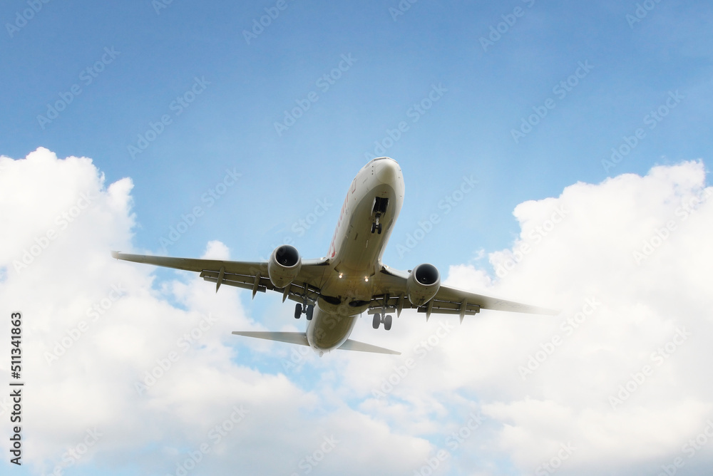 Airplane taking off under beatiful cloudy sky Airplane taking off under beatiful cloudy sky