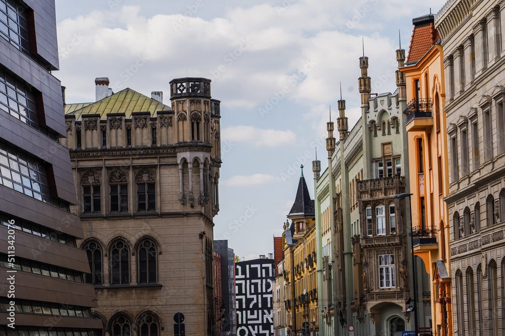 Old buildings on urban street with sky at background in Wroclaw