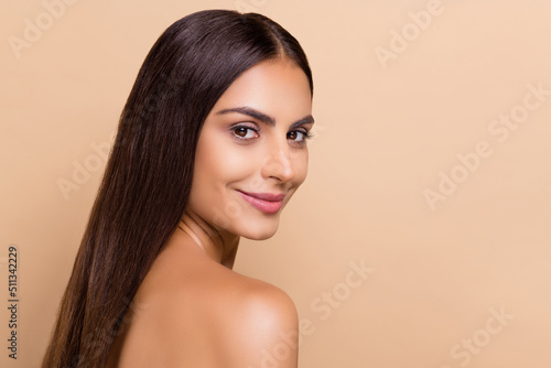 Profile side view portrait of attractive cheery delicate girl soft smooth skin copy space isolated over beige pastel color background