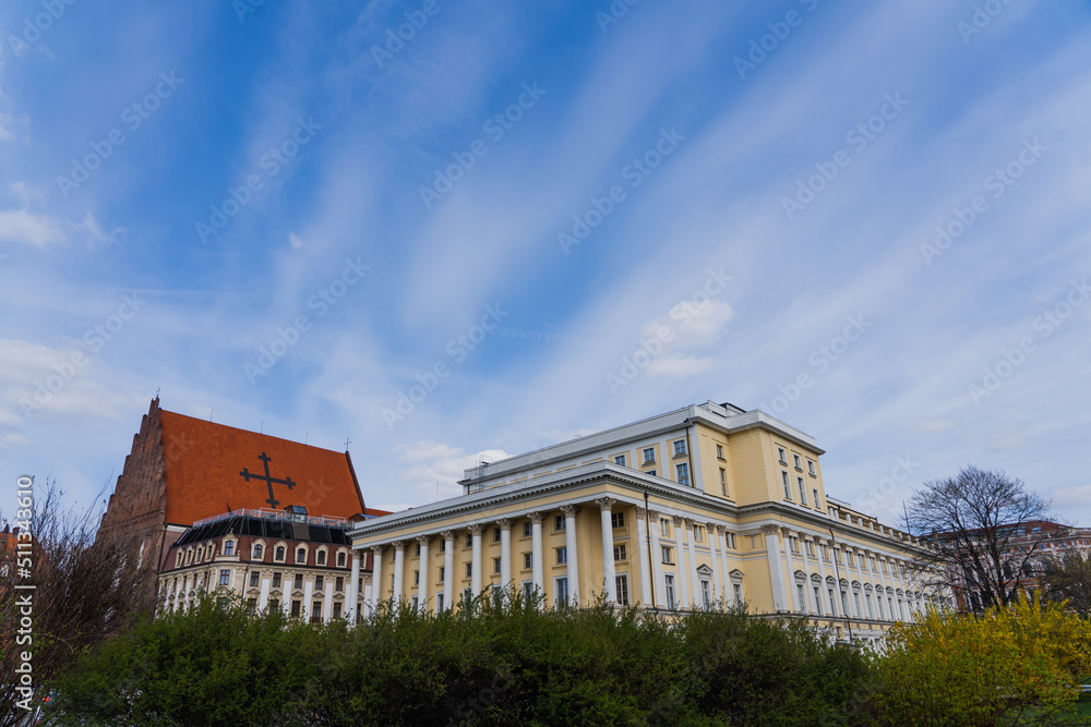 Buildings near Church St Dorothea with blue sky at background in Wroclaw
