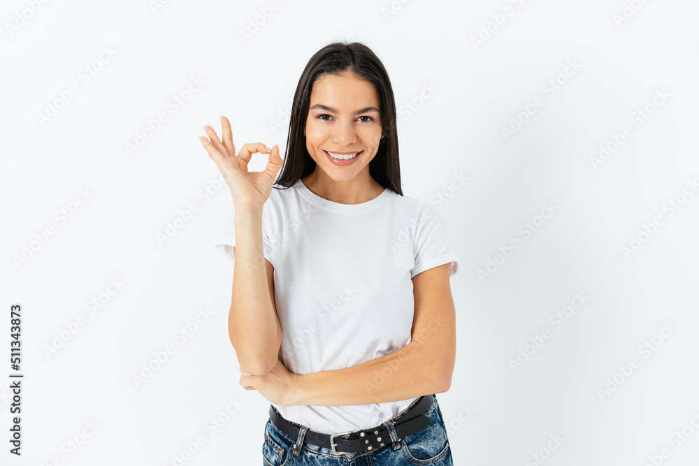 Happy confident young woman shows ok gesture Happy confident young woman shows ok gesture