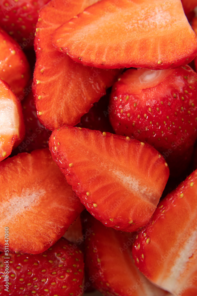 A lot of red ripe strawberries in a cut close-up. A lot of red ripe strawberries in a cut close-up.
