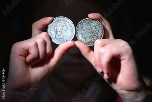 I will be rich! Coins in front of eye as symbol of love to money and strong motivation.