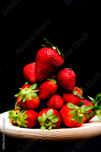 Fresh strawberries on black background