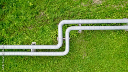 Aerial view of an industrial pipeline. Transportation of gaseous and liquid substances. Aboveground pipeline view from a height. The place of bending of the pipeline
