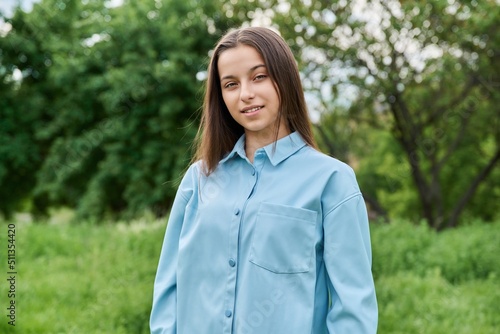 Outdoor portrait of a beautiful teenage girl 15 years old