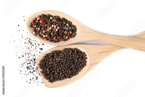 Colorful and black peppercorn mix, pepper pile with wooden spoon isolated on white, top view