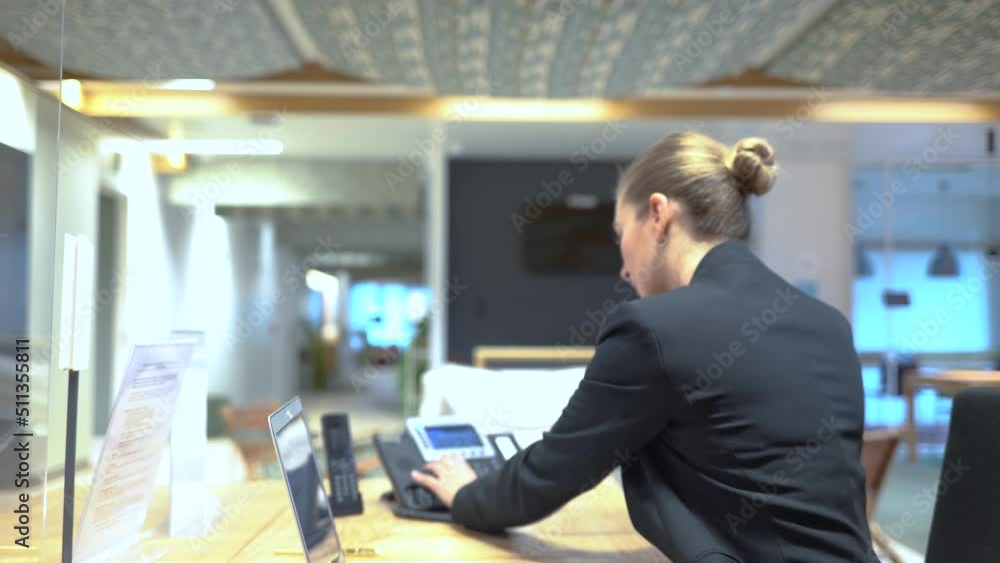 female operator in multinational reception take a call female operator in multinational reception take a call