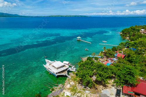 Calape, Bohol - Aerial of the coastline of Pangangan Island, with the islands of Sandingan and Cabilao visible in the horizon. photo