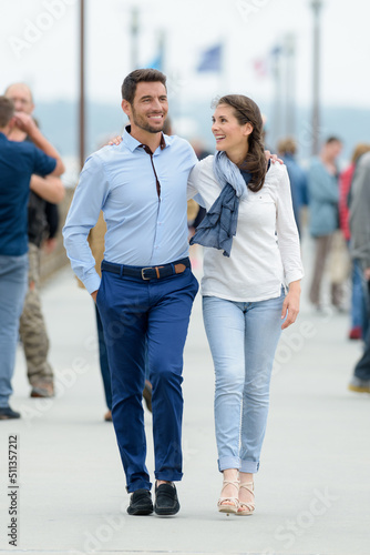 couple walking on a pontoon