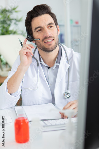 young male doctor in telehealth concept photo