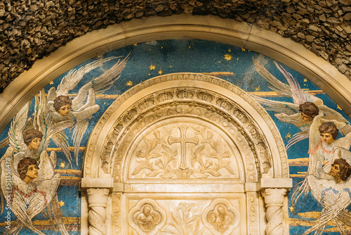 Mosaic panels depicting flying seraphim in chapel-tomb of Paskevich (1870-1889 Years) in city park. Famous local landmark Gomel, Belarus. Rumyantsevs and Paskeviches park. Close up. photo