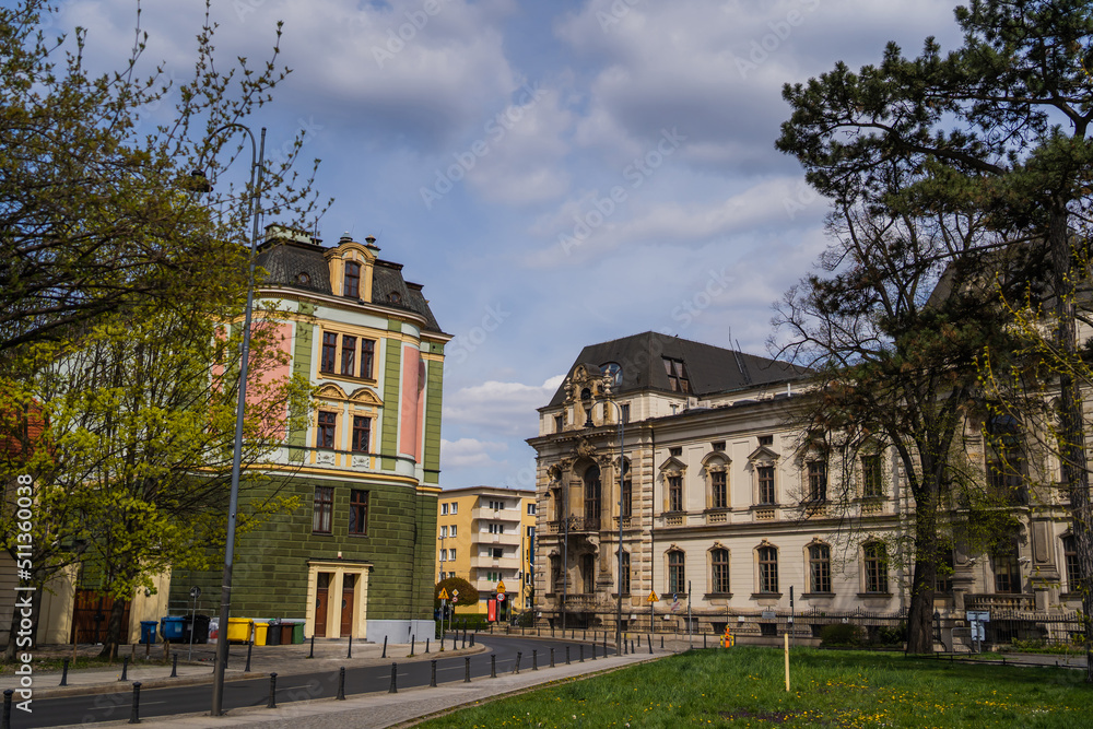 Old buildings and trees on urban street in Wroclaw