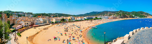 Fotografering A crowd of vacationers enjoy the warm beaches of Costa Brava