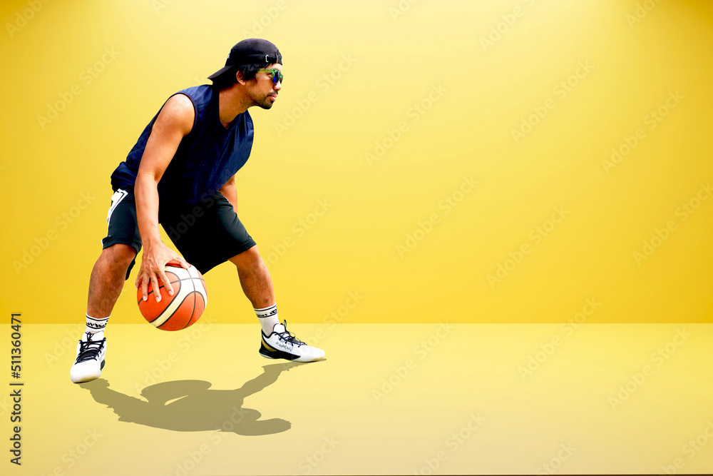 Asian basketball player on colored background