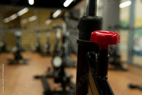 Red workout lever athletic bike cardio indoor floor healthy fitness, concept exercise vitality from equipment from machine home, endurance fit. Girl gray flexibility, © Ilya