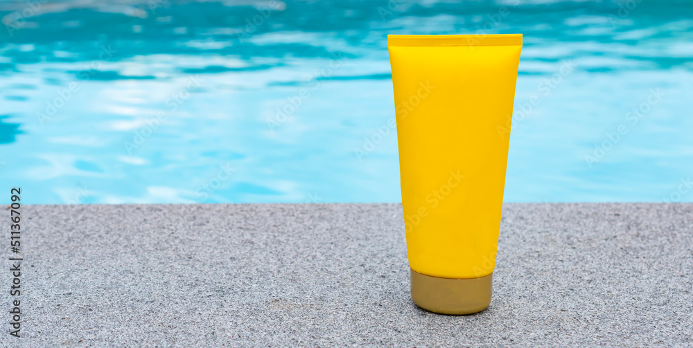 Tube of sunscreen at the swimming pool. Mock-up. Tube of sunscreen at the swimming pool. Mock-up.