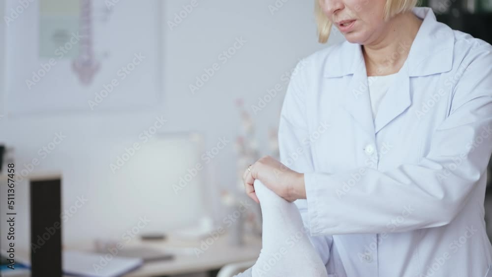 Doctor examining patient with foot injury, clinical examination, diagnostic Doctor examining patient with foot injury, clinical examination, diagnostic