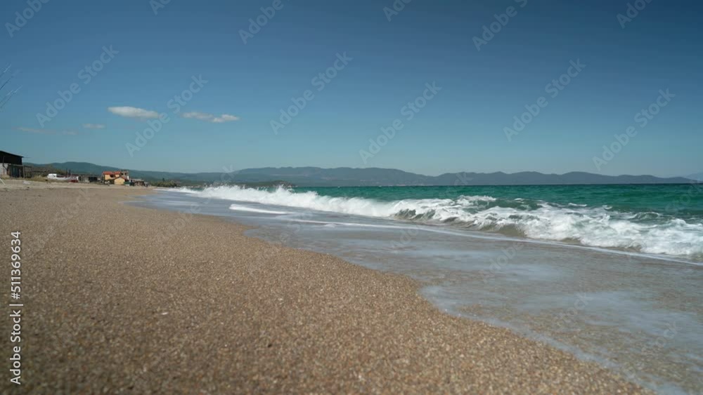 Low Angle view of Sandy Beach and Beach waves breaking on Beach Low Angle view of Sandy Beach and Beach waves breaking on Beach