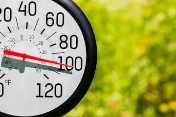 Outdoor thermometer in the sun during heatwave. Hot weather, high temperature and heat warning concept.