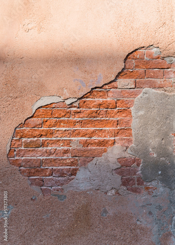background - old wall with exposed red bricks 