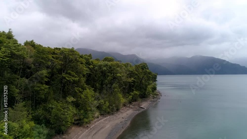 Wallpaper Mural Aerial Shot Of Idyllic Sea By Mountains Under Cloudy Sky, Drone Flying Forward Over Green Trees - Puerto Montt, Argentina Torontodigital.ca