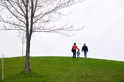 Family walking in the public park. A healthy lifestyle. © Elton
