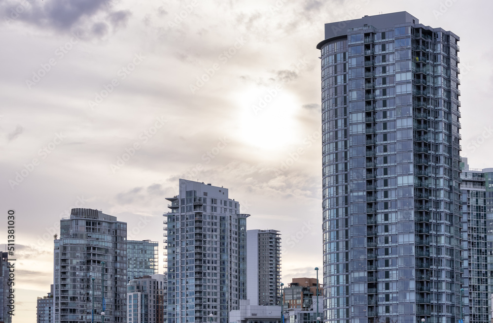 Fototapeta premium Residential Home Buildings in Downtown Vancouver, British Columbia, Canada. False Creek. Cloudy Sky Background