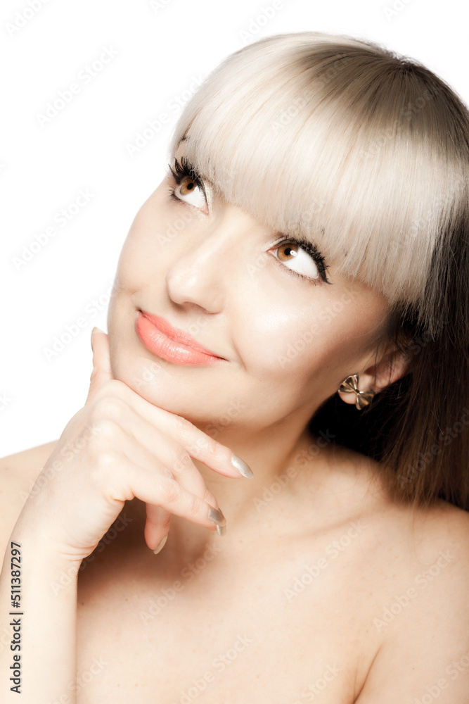 Fototapeta premium Close up portrait of a beautiful brunette girl with blond bangs fringe. Thinking face expression. .