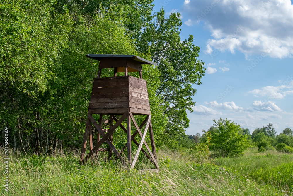 wooden hunting pulpit on the edge of the forest