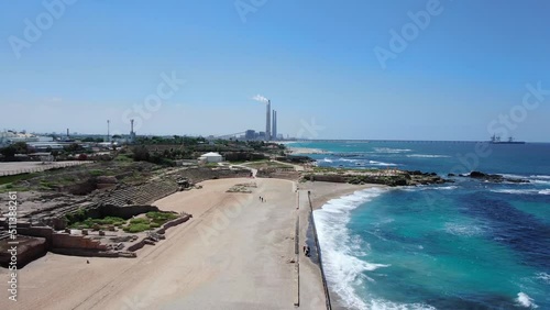 Caesarea Beach and archaeological site with electric chimneys, Aerial
Drone view over Mediterranean sea and  Caesarea Beach archaeological, site
 photo