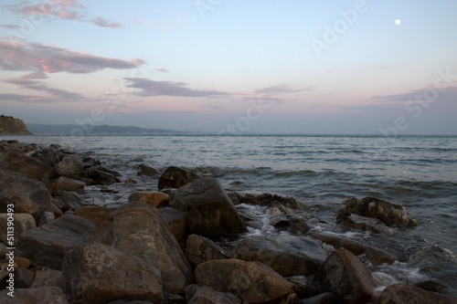 Pink sunset on the Black Sea coast. A late summer evening sinks ashore. Beautiful landscape. Russia. © m7_ir7