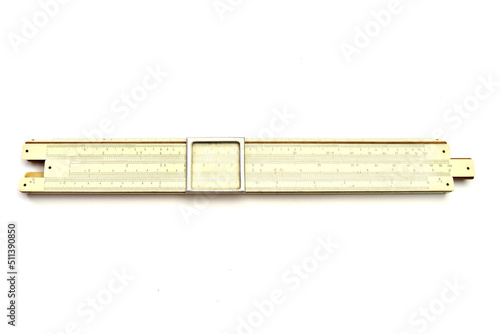Old mechanical pocket slide rule calculator isolated