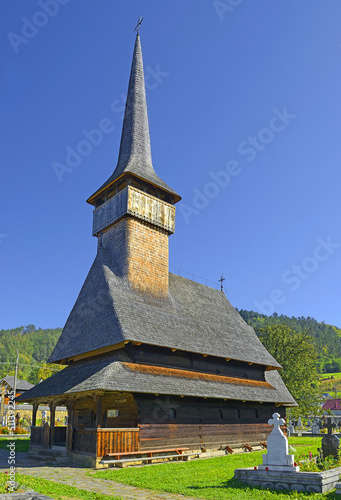 The wooden church Archangels Mihail and Gavril from Rozavlea. It belongs to a collection of  Wooden Churches of Maramures, Romania photo