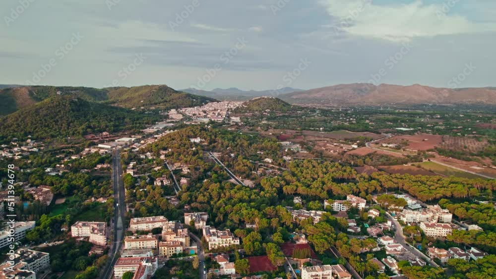 Panoramic view of a Spanish Town Port Cala Rajada with turquoise sea at sunset. Es Pelats and Cala Ratjada city from above in Majorca, Balearic Islands, Spain, drone view. Panoramic view of a Spanish Town Port Cala Rajada with turquoise sea at sunset. Es Pelats and Cala Ratjada city from above in Majorca, Balearic Islands, Spain, drone view.