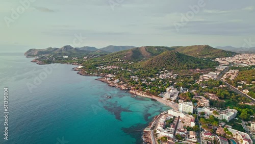Beautiful landscape beach on Majorca Island in Spain with Hotels and Resorts. Cala Son Moll Beach - early morning drone view from above of the Spanish East Coastline Balearic Islands.