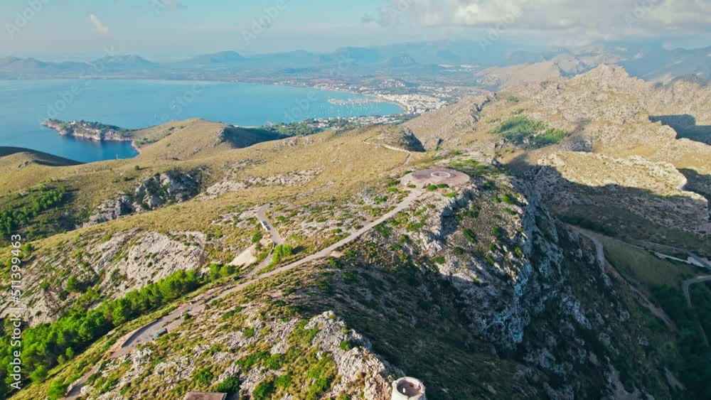Scenic views of a sunrise over the peak of Serra de Tramuntana in Majorca, Spain. Albercutx Watchtower - a Tower built to spot pirates, with sweeping cape and bay views on Balearic Islands, Spain. Scenic views of a sunrise over the peak of Serra de Tramuntana in Majorca, Spain. Albercutx Watchtower - a Tower built to spot pirates, with sweeping cape and bay views on Balearic Islands, Spain.