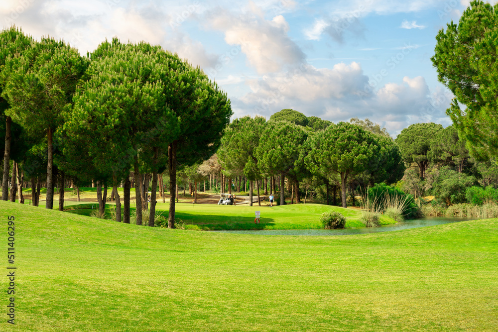 Fototapeta premium Scenic panoramic view of golf fairway at the golf course