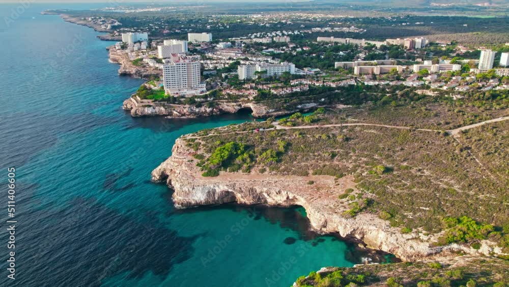 Modern build residence building with pool by the beach on rocky caves in Majorca. Carrer de Cala Antena, Cales de Mallorca, Balearic Islands, Spain. Modern build residence building with pool by the beach on rocky caves in Majorca. Carrer de Cala Antena, Cales de Mallorca, Balearic Islands, Spain.