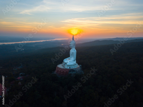 Top view Aerial photo from flying drone.Big Buddha Wat Phu Manorom Mukdahan Thailand.Buddha on the mountain.