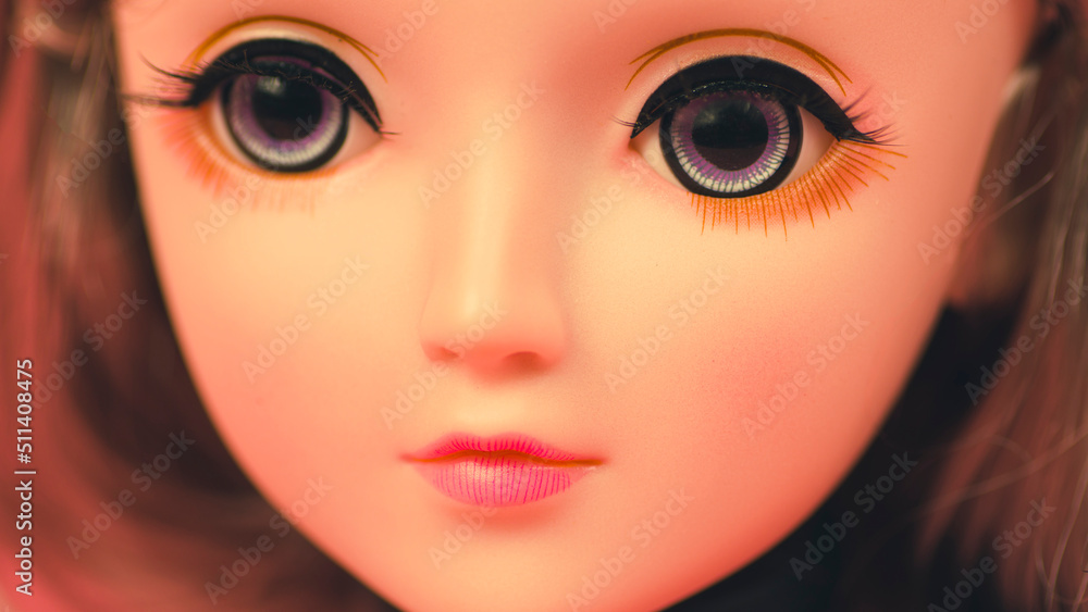 Beautiful doll. Close up. Portrait of attractive toy's face with big eyes. Beautiful doll. Close up. Portrait of attractive toy's face with big eyes.