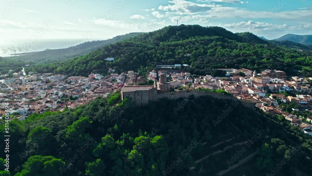Castell de Capdepera - remains of an ancient stone Spanish castle on Majorca. Panoramic view from above of Capdepera municipality with old traditional houses on Mallorca, Balearic Islands, Spain. Castell de Capdepera - remains of an ancient stone Spanish castle on Majorca. Panoramic view from above of Capdepera municipality with old traditional houses on Mallorca, Balearic Islands, Spain.