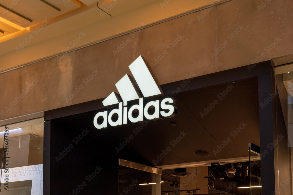 Houston, Texas, USA - February 25, 2022: Close up of Adidas store sign at a  shopping mall. Adidas AG is a German multinational corporation. Stock Photo  | Adobe Stock