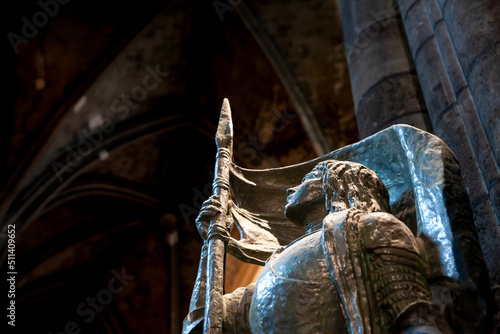 Selective blur on the statue of Joan of Arc, or Jeanne d'Arc, in Bordeaux Cathedral. Designed by antoine Bourdelle in 1929, it's dedicated to this french hero... photo