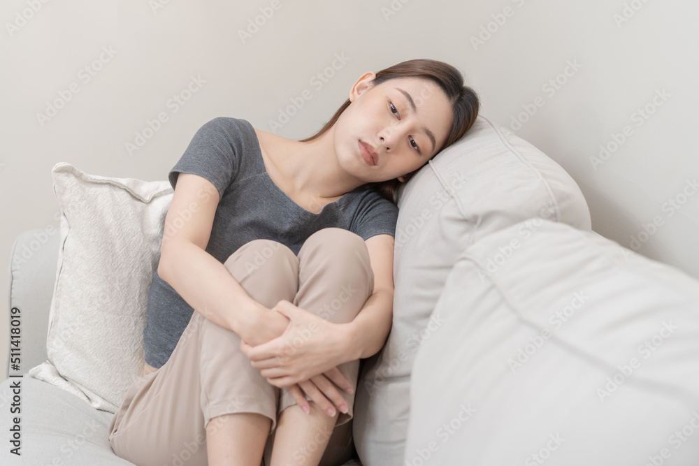 Mental health, depressed sad asian young woman, girl sitting on sofa, couch, expression to face difficulty, failure and exhausted. Thoughtful worried suffering depression feeling lonely, alone at home Mental health, depressed sad asian young woman, girl sitting on sofa, couch, expression to face difficulty, failure and exhausted. Thoughtful worried suffering depression feeling lonely, alone at home