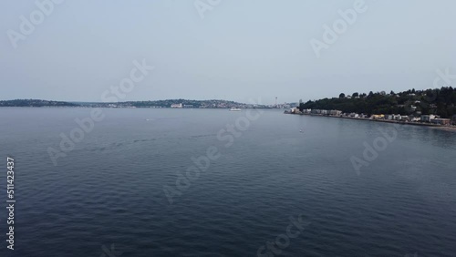 Wallpaper Mural Low angle drone shot flying over the Puget Sound with a ship and the Space Needle in the background. This 4K cinematic Seattle scene was filmed using a DJI Mini 2 drone. Torontodigital.ca