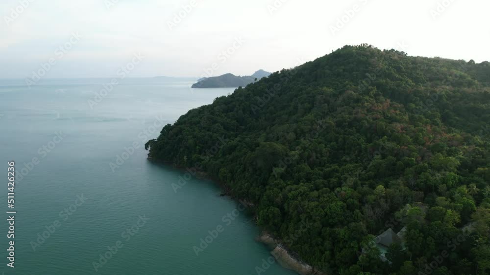 large mountain hill on a secluded tropical island in thailand during sunset, aerial large mountain hill on a secluded tropical island in thailand during sunset, aerial